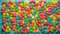 Alphabet with numbers, made with photo of brightly coloured jelly bean sweets as the background Royalty Free Stock Photo