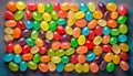 Alphabet with numbers, made with photo of brightly coloured jelly bean sweets as the background Royalty Free Stock Photo