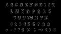 Alphabet, numbers.  Pencil drawing on black background. Royalty Free Stock Photo