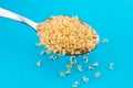 Alphabet pasta in spoon on a blue background Royalty Free Stock Photo
