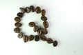 Alphabet Q form Coffee beans in white background Royalty Free Stock Photo