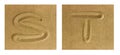 Alphabet S-T on sand Royalty Free Stock Photo