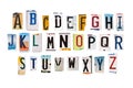 Alphabet set created with broken pieces of vintage car license plates on white Royalty Free Stock Photo