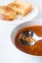 Alphabet soup with the word school spelled out in the spoon.