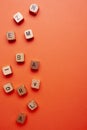 Alphabet wood dices on orange background Royalty Free Stock Photo