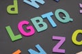 Alphabetic of colorful wooden with LGBTQ word on black background. Concept of LGBT activism