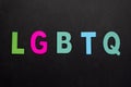 Alphabetic of colorful wooden with LGBTQ word on black background. Concept of LGBT activism