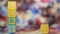 Alphabetical letters placed on colored wooden cubes forming the word LGBTQ