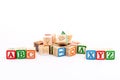 Alphabets cubes scattered on white background with a selective focused on ABC and XYZ alphabets