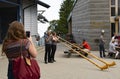 Switzerland lucerne Pilatus mountain and woman performing with a traditional alphorn or alpenhorn