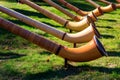 Alphorns laying on the grass on alpine meadow Royalty Free Stock Photo