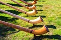 Alphorns laying on grass on the alpine meadow Royalty Free Stock Photo