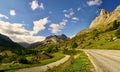 Alpin road with mountains ahead and beautiful scenery Royalty Free Stock Photo