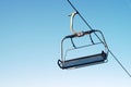 Alpine chair lift blue sky mountain ski winter fun snowboarding