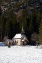 Alpine church near Braies lake along the walkway between the forest