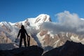 Alpine Climber Arranging Descent with Rope and Ice Axe