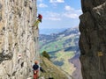 Alpine climbers on the Ebenalp mountain cliffs in the Appenzellerland region and Alpstein mountain range