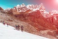 Alpine Climbers Team moving on Glacier high Mountains Sunshine Background