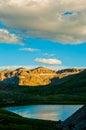 Alpine Colorado Lake reflection Cloudy sunset Vertical Royalty Free Stock Photo