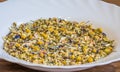 Alpine Field. Herbal tea with lemongrass, flowers and camomile on the white plate. Top view. Close up. High resolution. Alpine Royalty Free Stock Photo