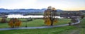 Alpine foothills upper bavaria, dreamy evening scenery. lake riegsee and country road in autumn