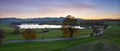 Alpine foothills upper bavaria, dreamy evening scenery. lake riegsee and country road