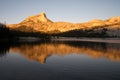 Alpine Glow on Cathedral Peak reflected in the lake Royalty Free Stock Photo