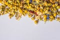 Alpine herbs tea on a white background .Alpine Field. Herbal tea with lemongrass, flowers and chamomile. Top view. Close up. High Royalty Free Stock Photo