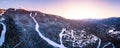 Alpine homes on hill at sunset, Whistler Mountain, aerial footage, winter scene, log cabin, luxury vacation home Royalty Free Stock Photo