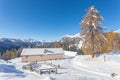 Alpine hut in front of a beautiful winter scenery, Val Fiorentina, Dolomites Royalty Free Stock Photo