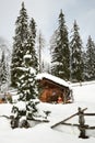 Alpine hut in winter in the Alps. Winter Landscape in a Forest near Lake Antholz Anterselva, South Tirol. Royalty Free Stock Photo