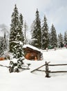 Alpine hut in winter in the Alps. Winter Landscape in a Forest near Lake Antholz Anterselva, South Tirol. Royalty Free Stock Photo