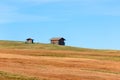 Alpine huts on the bend of the Seiser Alm plateau hill. South Tyrol, Italy