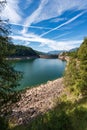 Alpine lake with dam - Lago di Paneveggio Trentino Alto Adige Italy Royalty Free Stock Photo