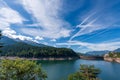 Alpine lake with dam - Lago di Paneveggio Trentino Alto Adige Italy Royalty Free Stock Photo