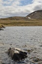 Alpine Lake in dolomites Italy clouded cold water surface Royalty Free Stock Photo