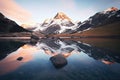 alpine lake reflecting surrounding mountains at dusk Royalty Free Stock Photo