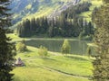 The alpine lake Seeblisee at the foot of the mountain range First and in the Schwyz Alps mountain massif, Oberiberg - Switzerland Royalty Free Stock Photo