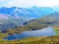 The alpine lake Tannensee or Tannen Lake in the Uri Alps mountain massif, Melchtal - Canton of Obwald, Switzerland Royalty Free Stock Photo