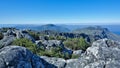 Alpine landscape. Ancient gray boulders lie on the flat summit of Table Mountain.