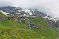 Alpine landscape with Matterhorn peak Cervino behind de clouds of the sky, Breuil-Cervinia, Aosta Valley, Italy Royalty Free Stock Photo