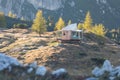 Alpine landscape, Mountains, fir trees and above all larches typical yellow autumn color. Southern Tyrol. Glamping luxury camping. Royalty Free Stock Photo