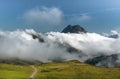 alpine landscape in the mountains near kaprun with peak covered in the clouds