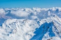 Alpine landscape with peaks covered by snow and clouds Royalty Free Stock Photo