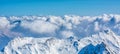 Alpine landscape with peaks covered by snow and clouds Royalty Free Stock Photo