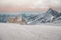 Alpine landscape with peaks covered by snow and clouds, beautiful colors at the top of a glacier. Royalty Free Stock Photo