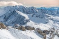 Alpine landscape with peaks covered by snow and clouds, beautiful colors at the top of a glacier Royalty Free Stock Photo