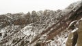 Alpine landscape with peaks covered by snow. Shot. Top view of the mountains covered with snow Royalty Free Stock Photo