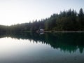 Alpine mountain lake boathouse panorama at Laghi di Fusine Weissenfelser See in Tarvisio Udine Dolomites alps Italy Royalty Free Stock Photo