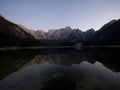 Alpine mountain lake landscape panorama reflection at Laghi di Fusine Weissenfelser See in Tarvisio Dolomites alps Italy Royalty Free Stock Photo